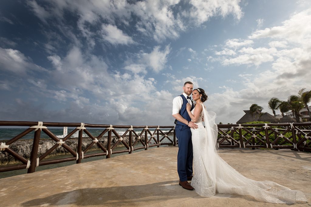 Hard Rock Riviera Maya destination wedding. Photos by Rich Paprocki in Rochester NY. bride and groom lit with off camera flash near the water